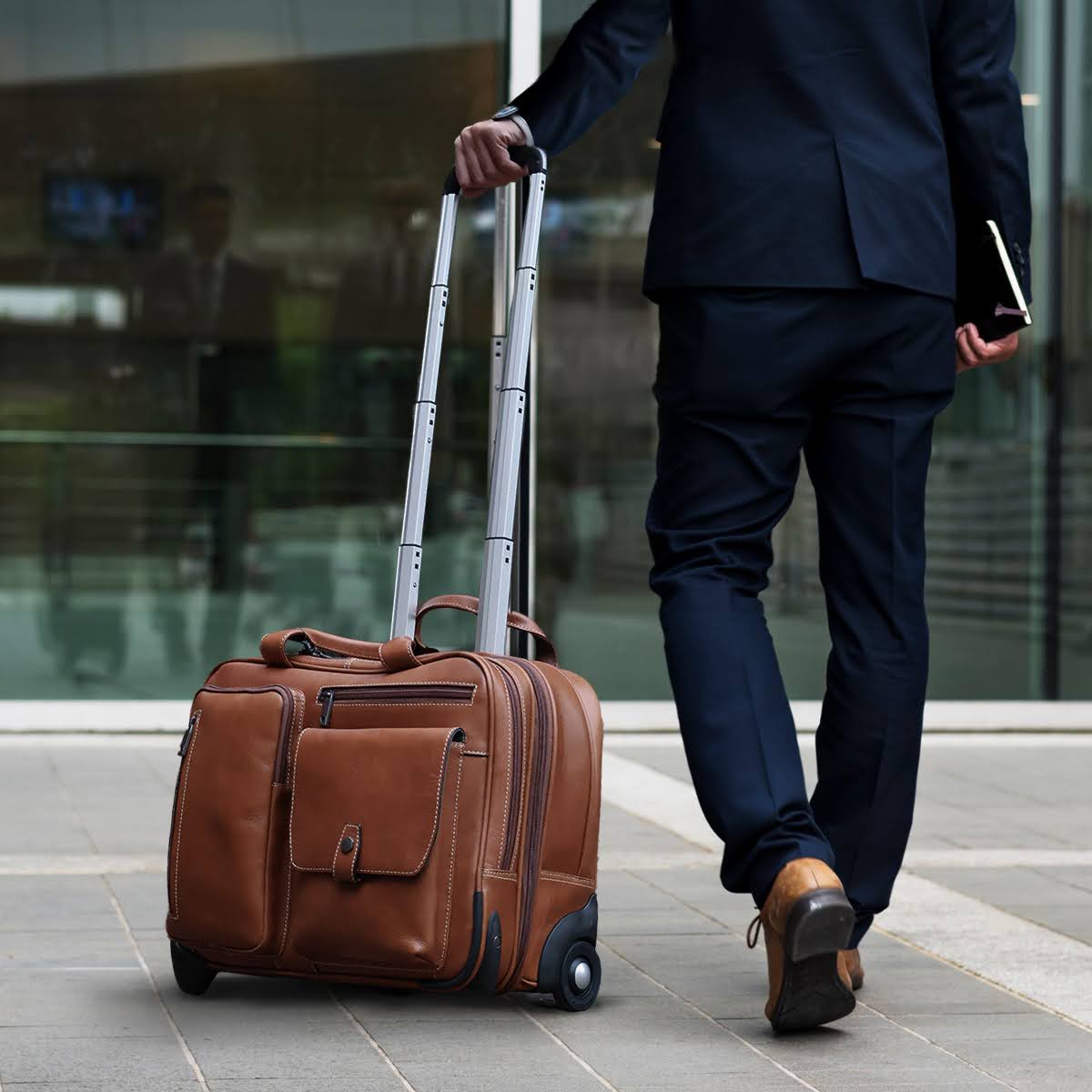 Mobile cabin office bag 44cm in Colt leather by Jekyll & Hide, carried by a traveller in an airport